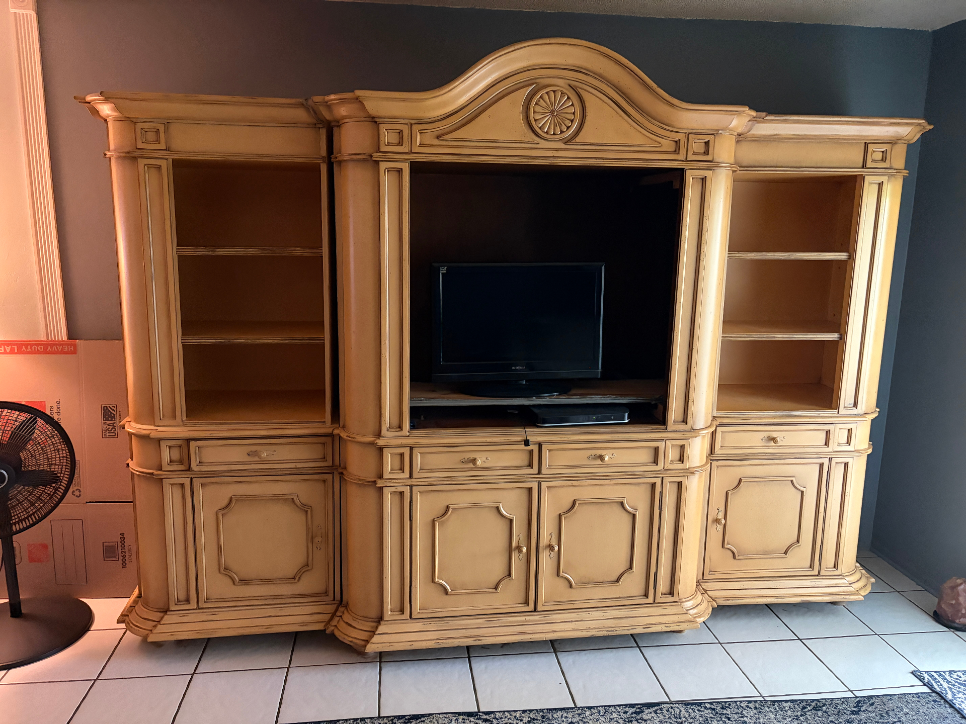 South Florida furniture removal — large wood entertainment center and bulky household furniture hauled away by Fresh Start Junk Removal